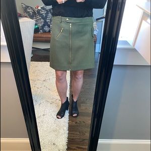 J Crew olive wool short skirt. Zippered pocket and detail in front. Size 8.